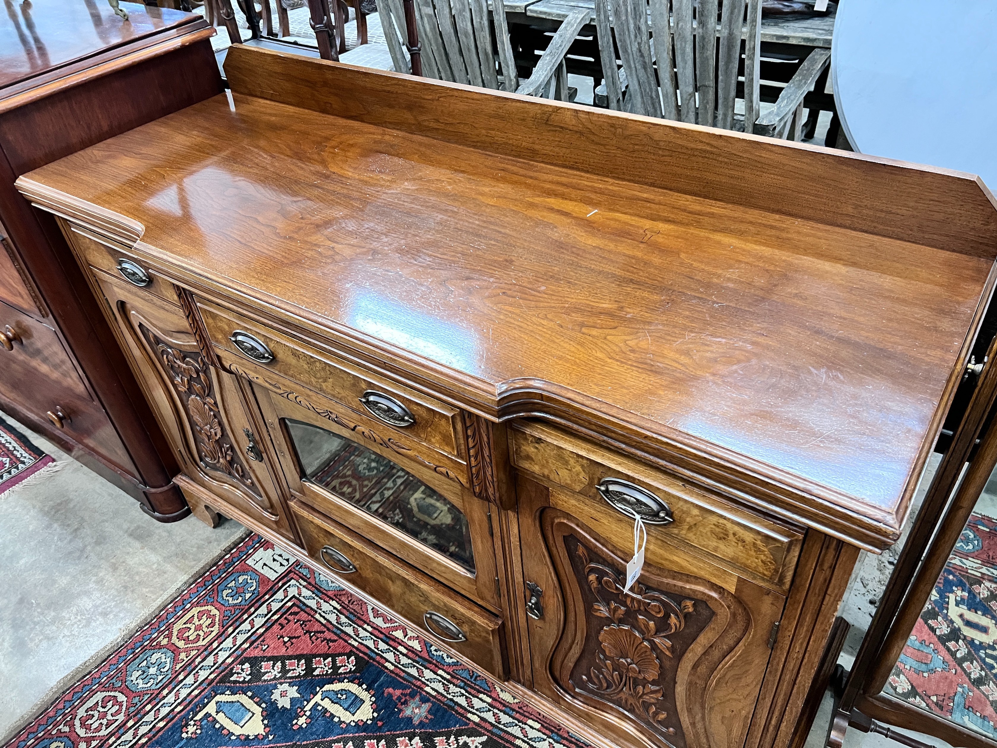 A late Victorian carved walnut breakfront sideboard, length 153cm, depth 52cm, height 107cm *Please note the sale commences at 9am.